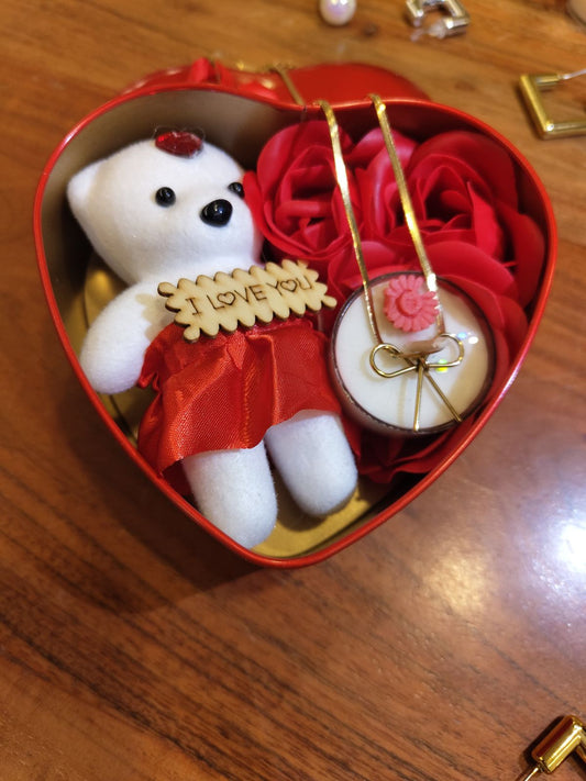 Gifting Combo      1x Bow Pendant , 1x scented candle (vanilla) ,Heart Box with Teddy and Roses.❤️❤️